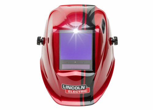 Auto-darkening welding helmet with modular LED light attachment