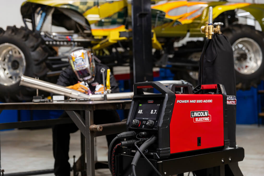 Lincoln Electric Power MIG 220 AC/DC Multi-Process Welder #K5379-1 in mechanic shop